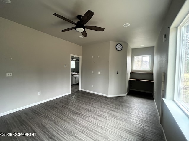49045 Gemini Ct, Soldotna, AK 99669 - unfurnished room with baseboards, a ceiling fan, and dark wood-style flooring