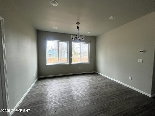 49045 Gemini Ct, Soldotna, AK 99669 - unfurnished dining area with baseboards, dark wood-style floors, and a chandelier