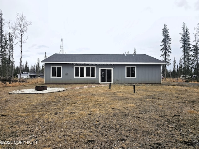 49045 Gemini Ct, Soldotna, AK 99669 - rear view of house with a fire pit
