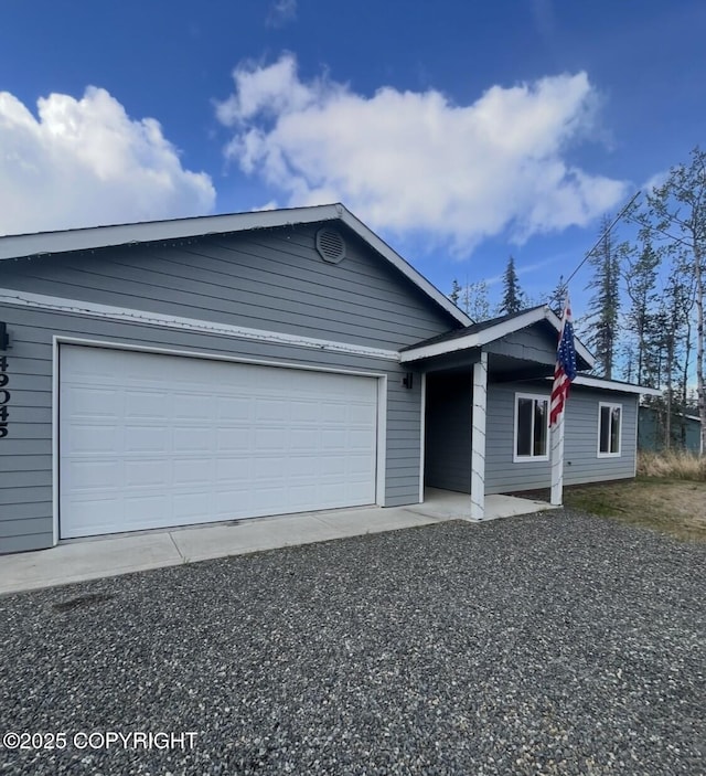 49045 Gemini Ct, Soldotna, AK 99669 - ranch-style house featuring a garage and driveway