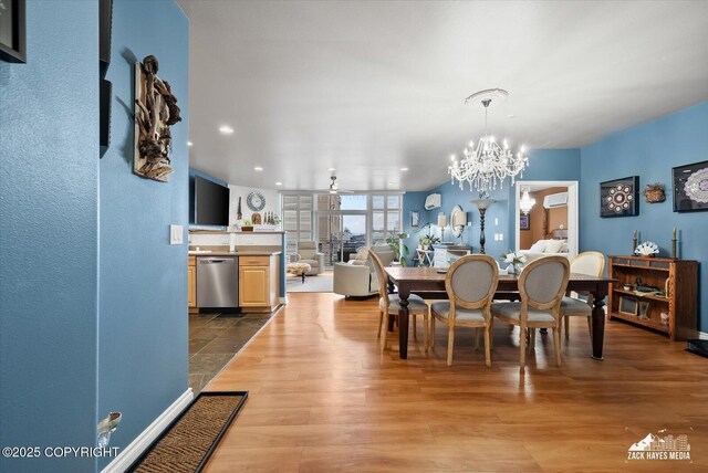 222 E 7th Ave # 106, Anchorage, AK 99501 - dining space featuring an inviting chandelier, recessed lighting, dark wood finished floors, and a wall mounted air conditioner