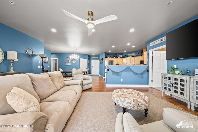 222 E 7th Ave # 106, Anchorage, AK 99501 - living area featuring ceiling fan with notable chandelier, recessed lighting, and wood finished floors