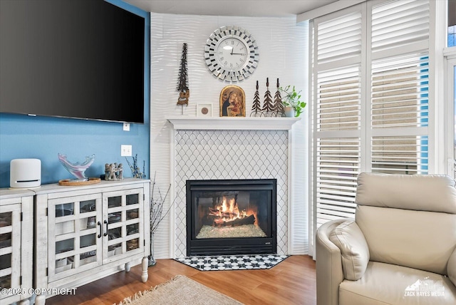 222 E 7th Ave # 106, Anchorage, AK 99501 - interior space featuring wood finished floors and a tile fireplace