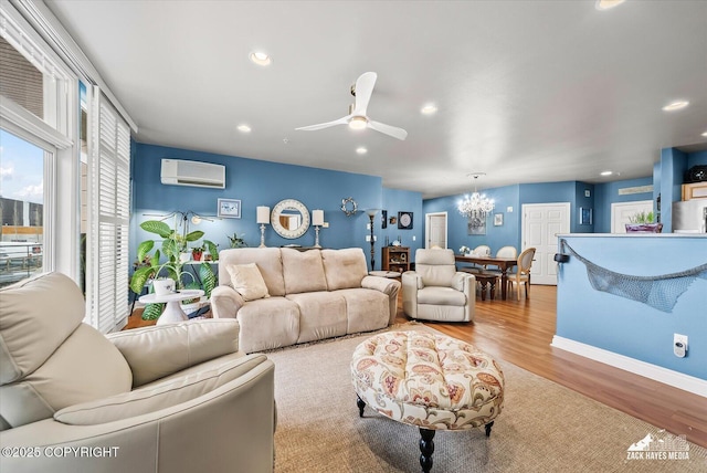 222 E 7th Ave # 106, Anchorage, AK 99501 - living area with an AC wall unit, ceiling fan with notable chandelier, recessed lighting, baseboards, and wood finished floors