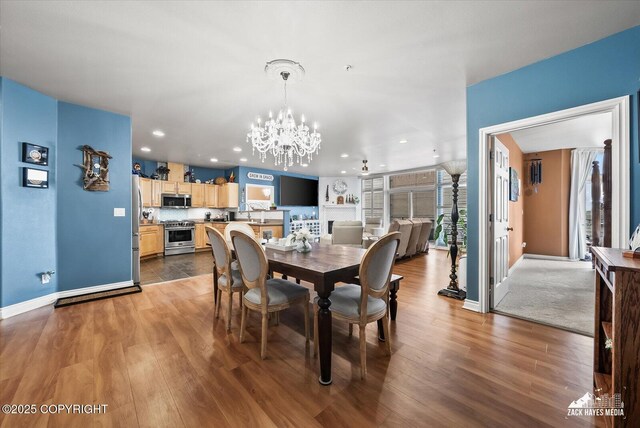 222 E 7th Ave # 106, Anchorage, AK 99501 - dining room featuring recessed lighting, an inviting chandelier, and wood finished floors
