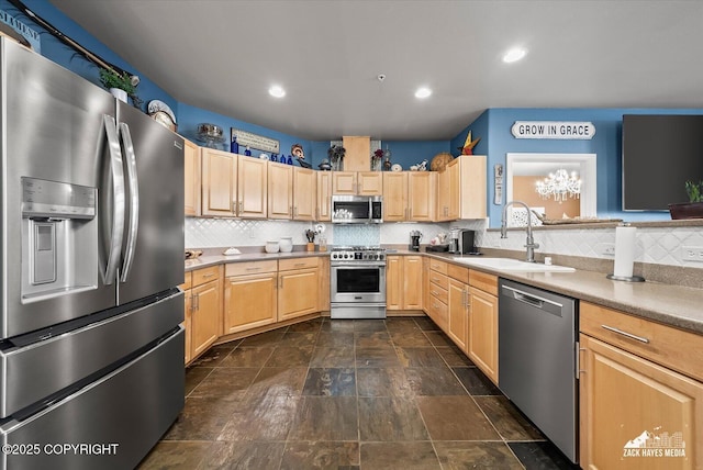222 E 7th Ave # 106, Anchorage, AK 99501 - kitchen with backsplash, a sink, appliances with stainless steel finishes, and light brown cabinetry