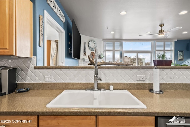 222 E 7th Ave # 106, Anchorage, AK 99501 - kitchen with plenty of natural light, a sink, a ceiling fan, and tasteful backsplash