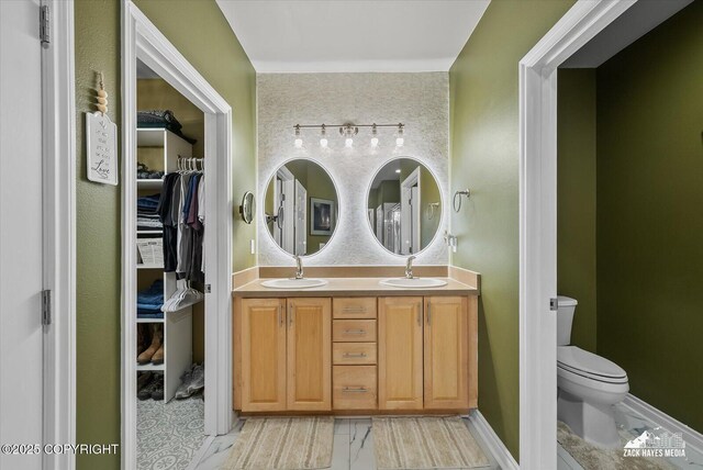 222 E 7th Ave # 106, Anchorage, AK 99501 - full bath featuring a sink, a walk in closet, toilet, and double vanity