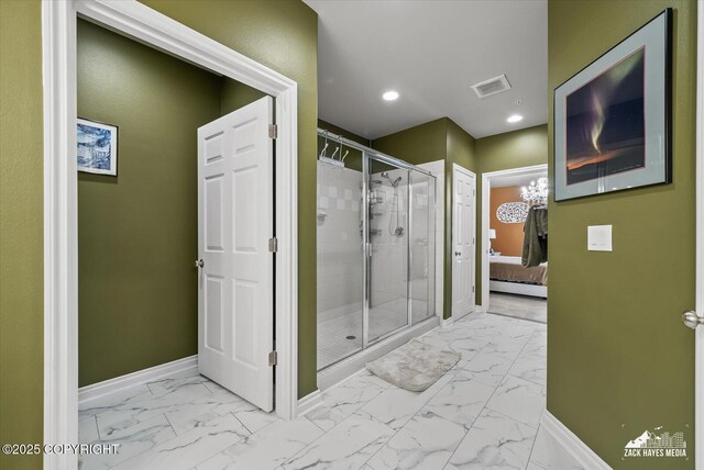 222 E 7th Ave # 106, Anchorage, AK 99501 - bathroom with marble finish floor, baseboards, ensuite bathroom, visible vents, and a stall shower