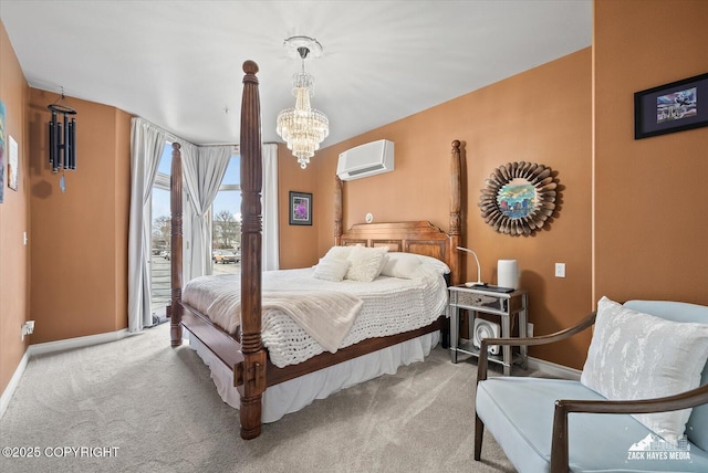 222 E 7th Ave # 106, Anchorage, AK 99501 - carpeted bedroom with baseboards, a wall mounted air conditioner, a notable chandelier, and access to outside