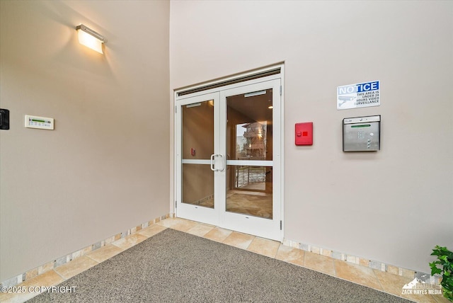 222 E 7th Ave # 106, Anchorage, AK 99501 - doorway to property featuring french doors and stucco siding
