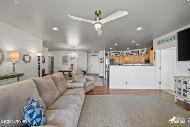 222 E 7th Ave # 106, Anchorage, AK 99501 - living area featuring wood finished floors, ceiling fan, a chandelier, and recessed lighting