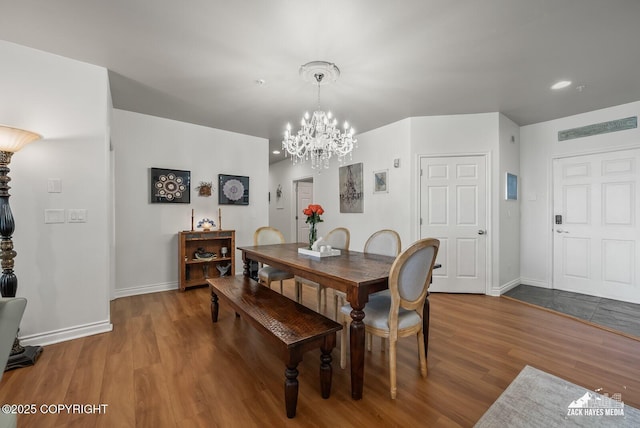 222 E 7th Ave # 106, Anchorage, AK 99501 - dining space featuring a chandelier, wood finished floors, and recessed lighting