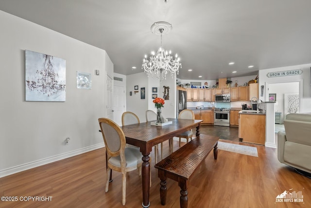 222 E 7th Ave # 106, Anchorage, AK 99501 - dining room featuring dark wood-type flooring, a chandelier, and recessed lighting