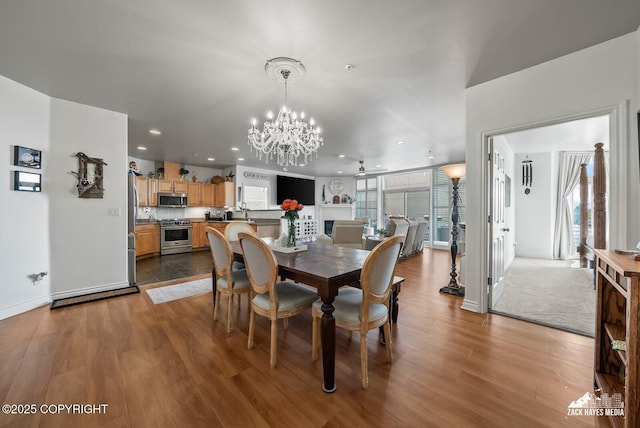 222 E 7th Ave # 106, Anchorage, AK 99501 - dining space with a chandelier, dark wood-type flooring, and recessed lighting
