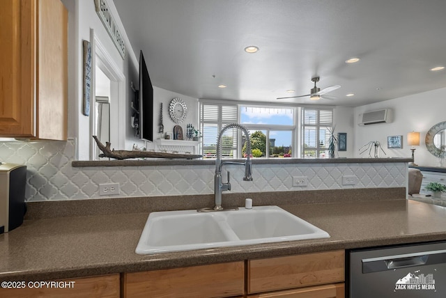 222 E 7th Ave # 106, Anchorage, AK 99501 - kitchen featuring stainless steel dishwasher, dark countertops, a wall unit AC, backsplash, and recessed lighting