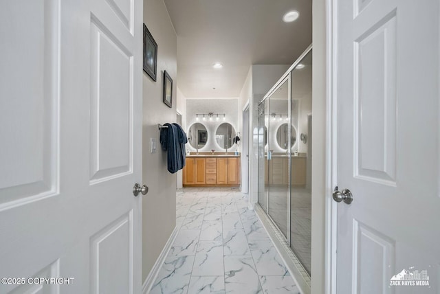 222 E 7th Ave # 106, Anchorage, AK 99501 - full bath featuring marble look tile flooring, a stall shower, double vanity, and recessed lighting