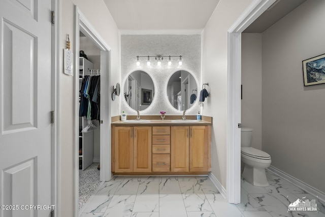 222 E 7th Ave # 106, Anchorage, AK 99501 - bathroom with marble finish floors, double vanity, and a walk in closet
