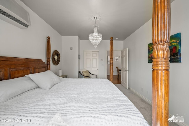 222 E 7th Ave # 106, Anchorage, AK 99501 - bedroom featuring an AC wall unit, light carpet, and a chandelier