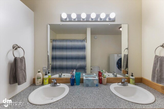 full bathroom with vanity, washer / clothes dryer, and curtained shower