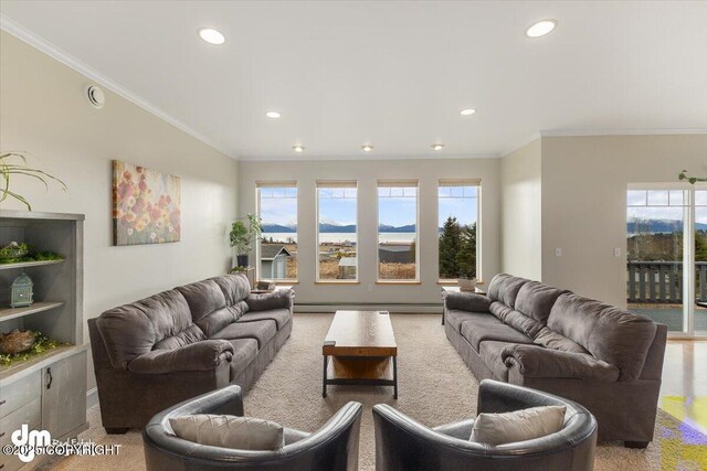 living area with recessed lighting, ornamental molding, plenty of natural light, and baseboard heating
