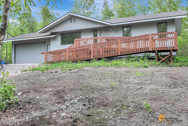 5900 E Liberty Ct, Wasilla, AK 99654 - ranch-style home featuring a garage, a wooden deck, and a shingled roof