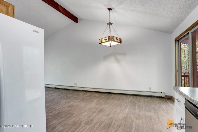 5900 E Liberty Ct, Wasilla, AK 99654 - unfurnished dining area featuring light wood finished floors, a textured ceiling, and a baseboard heating unit