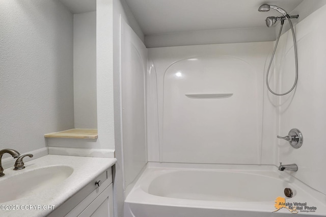 5900 E Liberty Ct, Wasilla, AK 99654 - full bathroom with bathtub / shower combination, vanity, and a textured wall