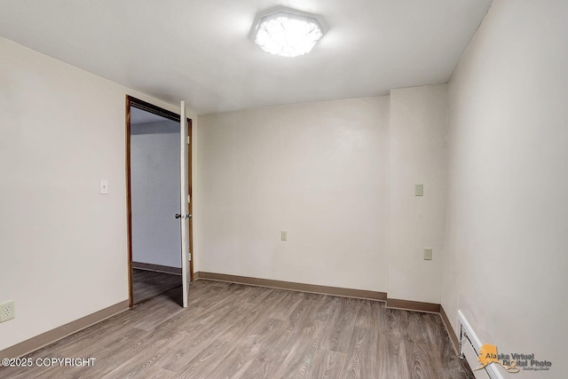 5900 E Liberty Ct, Wasilla, AK 99654 - empty room featuring light wood-style flooring and baseboards