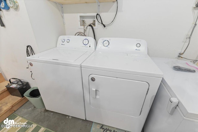 laundry area with laundry area and washer and clothes dryer