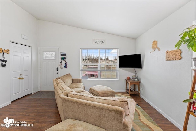 living room featuring baseboards, dark wood finished floors, and lofted ceiling