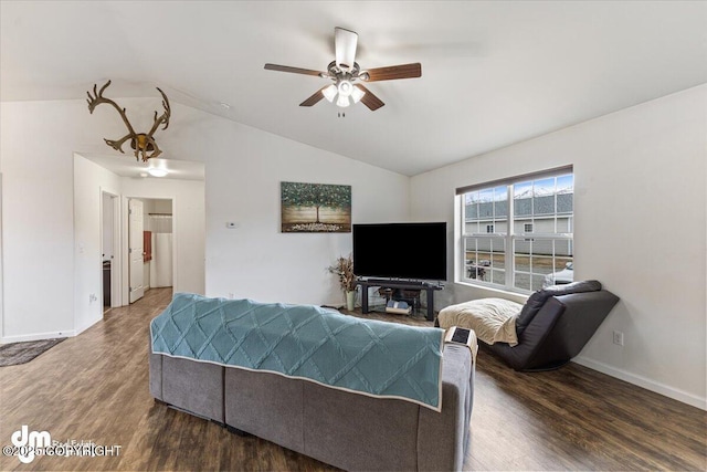 living area featuring baseboards, a ceiling fan, wood finished floors, and lofted ceiling