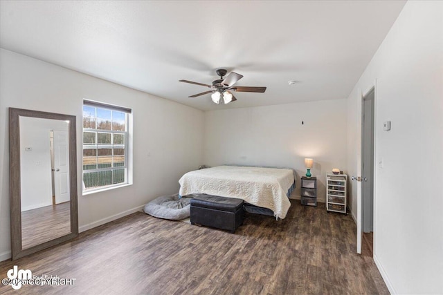 bedroom featuring baseboards, a ceiling fan, and wood finished floors