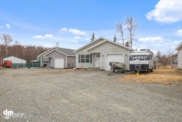 ranch-style home featuring driveway