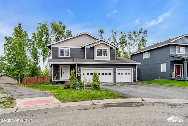 13050 Curry Ridge Cir, Eagle River, AK 99577 - traditional-style house featuring driveway, board and batten siding, and a garage
