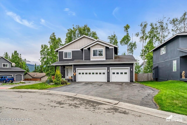 13050 Curry Ridge Cir, Eagle River, AK 99577 - traditional home with driveway, board and batten siding, and an attached garage
