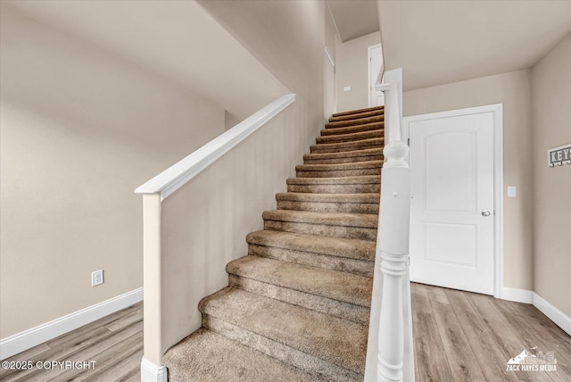 13050 Curry Ridge Cir, Eagle River, AK 99577 - stairs featuring wood finished floors and baseboards