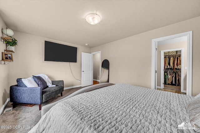 13050 Curry Ridge Cir, Eagle River, AK 99577 - carpeted bedroom featuring baseboards and a spacious closet