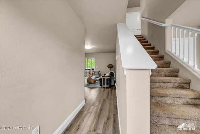 13050 Curry Ridge Cir, Eagle River, AK 99577 - staircase featuring baseboards and wood finished floors