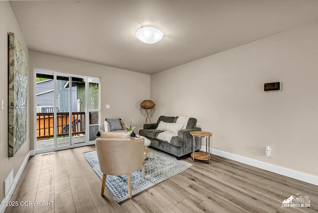 13050 Curry Ridge Cir, Eagle River, AK 99577 - living area featuring wood finished floors and baseboards