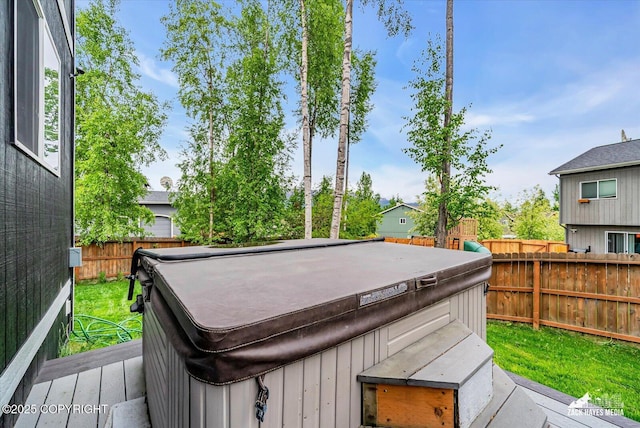 13050 Curry Ridge Cir, Eagle River, AK 99577 - wooden deck with a hot tub and a fenced backyard