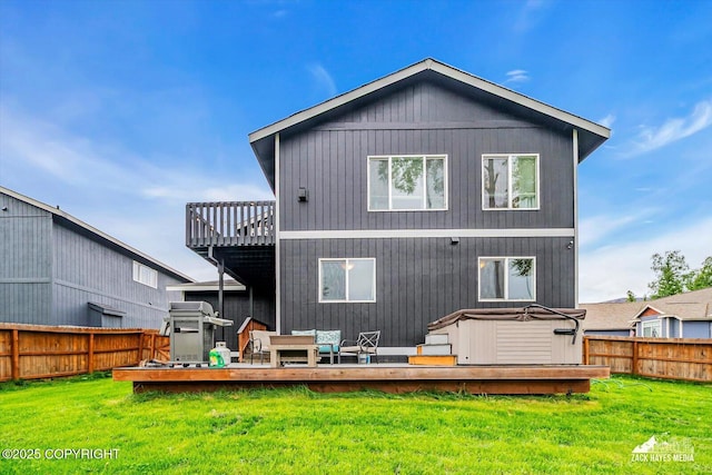 13050 Curry Ridge Cir, Eagle River, AK 99577 - back of house featuring a deck and a hot tub