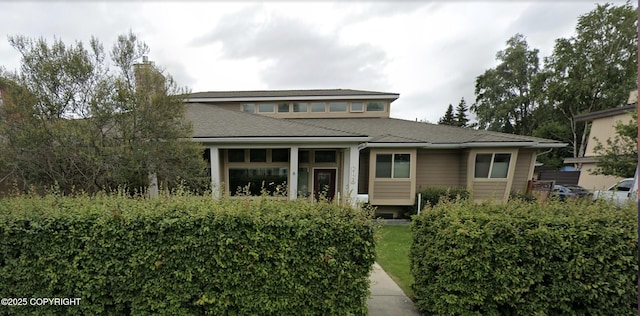 view of front facade featuring a chimney