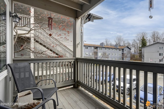 wooden terrace featuring a residential view