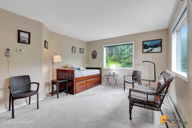 carpeted bedroom with baseboards, multiple windows, and a baseboard radiator