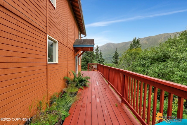 wooden terrace featuring a mountain view