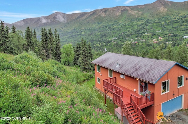 view of mountain feature with a view of trees