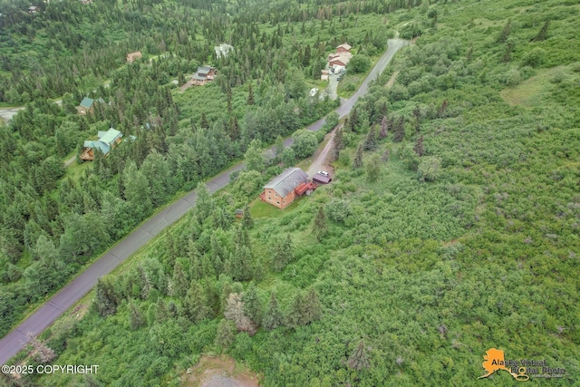 aerial view featuring a view of trees