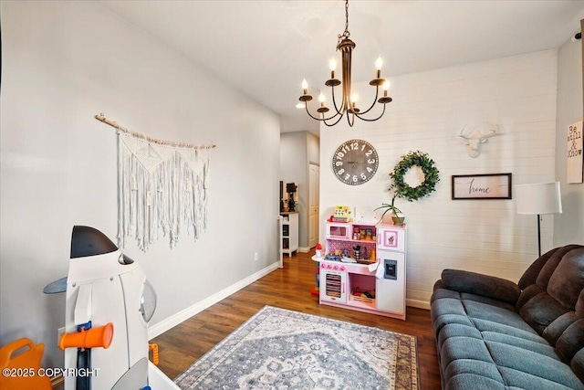 2153 S Withers Rd, Wasilla, AK 99654 - living room featuring wood finished floors and a chandelier