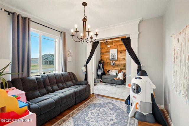 2153 S Withers Rd, Wasilla, AK 99654 - living room featuring a chandelier, wood finished floors, and wood walls